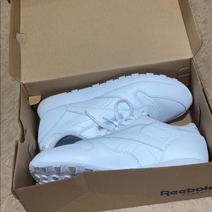 All white Reebok sneakers